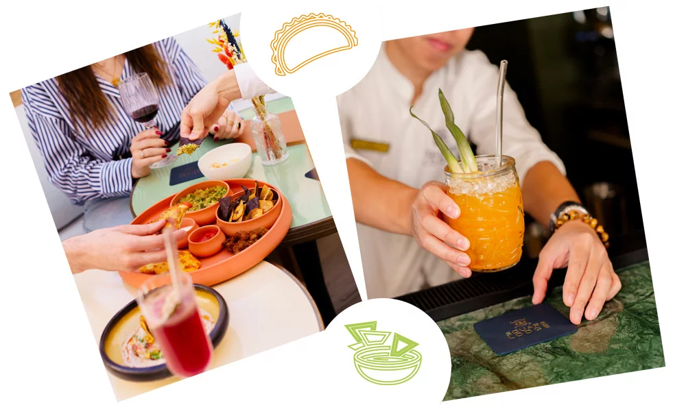 Sélection Para Picar à partager avec guacamole, arepas, empanadas, calamares fritos, et serveur tenant un cocktail exotique au bar, ambiance festive au Restaurant Andina.
